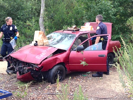 car positas las over abandoned crashed embankment crashes single cliff evidence officers collect police left city after independent ray ford