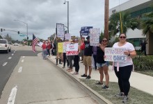 Dozens Rally Against Medical Worker Vaccine Mandate