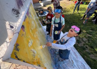 ‘Take That, COVID’: Harding Elementary Students Sling Paint in Therapeutic Project