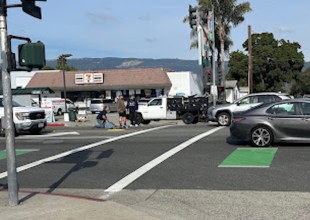 Bystanders Help Man Lying in Center of Hollister Avenue in Old Town Goleta