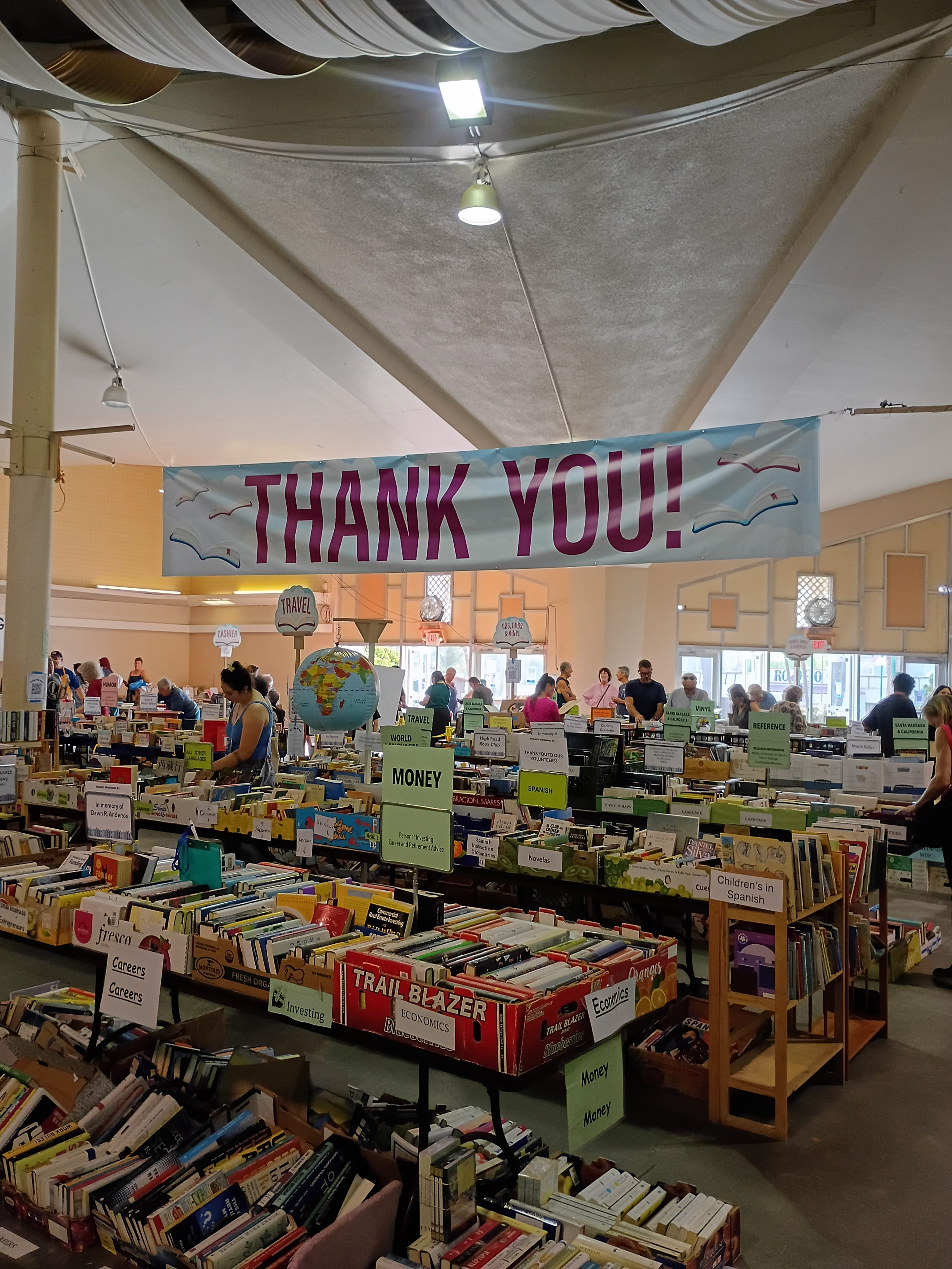 Supporters fill book bags at Mary Jane McCord Planned Parenthood Book Sale; volunteer says community support up 25% over last year